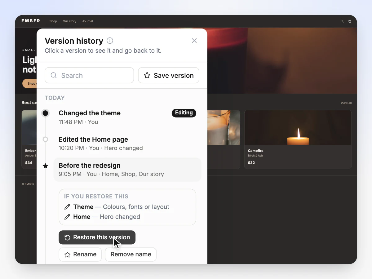 Version history with a theme change at 11:48 PM in the editor and the earlier named version, Before the redesign, open with Restore this version under the pointer